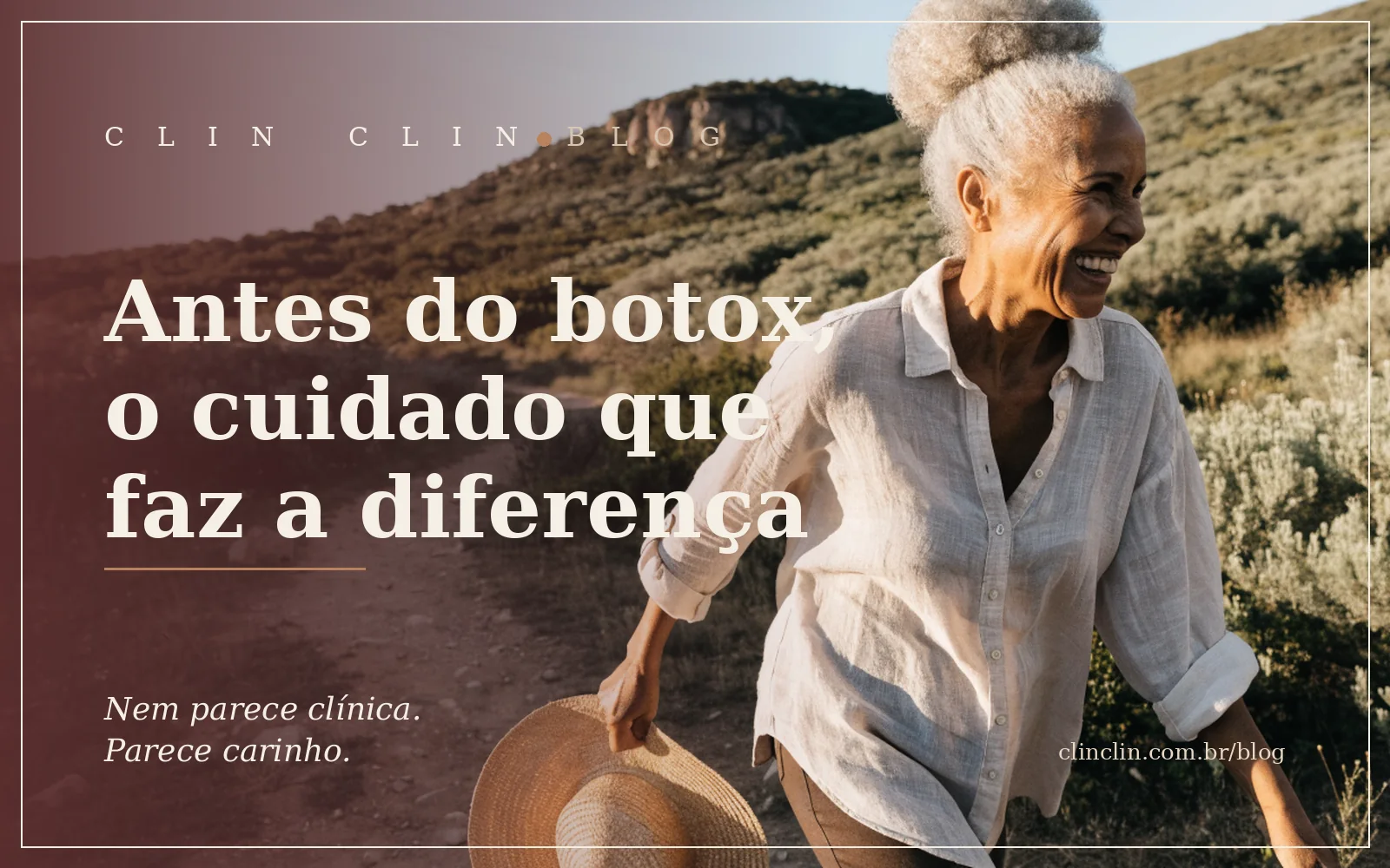 Mulher negra de uns sessenta anos, com cabelo prateado em coque alto, rindo de lado enquanto caminha com um chapéu de palha na mão por uma trilha de morro, na luz dourada do fim de tarde.